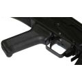 Angled close-up of AK-Builder Saiga 12 trigger guard and black textured pistol grip installed.