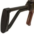 Angled view of black Polish Beryl AKM sidefolding stock mounted on receiver with ribbed buttpad.